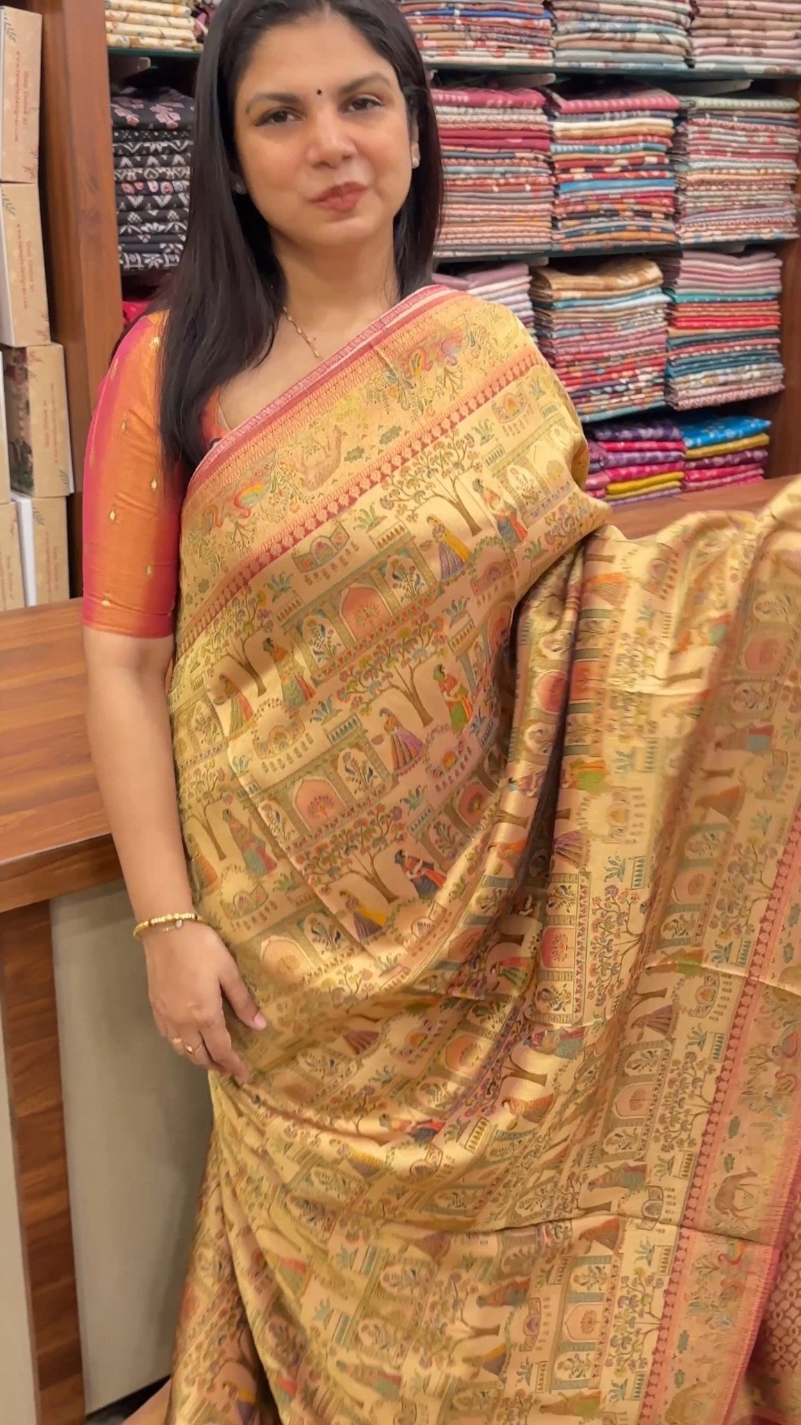 This elegant pashmina saree features intricate Mughal-inspired flor...