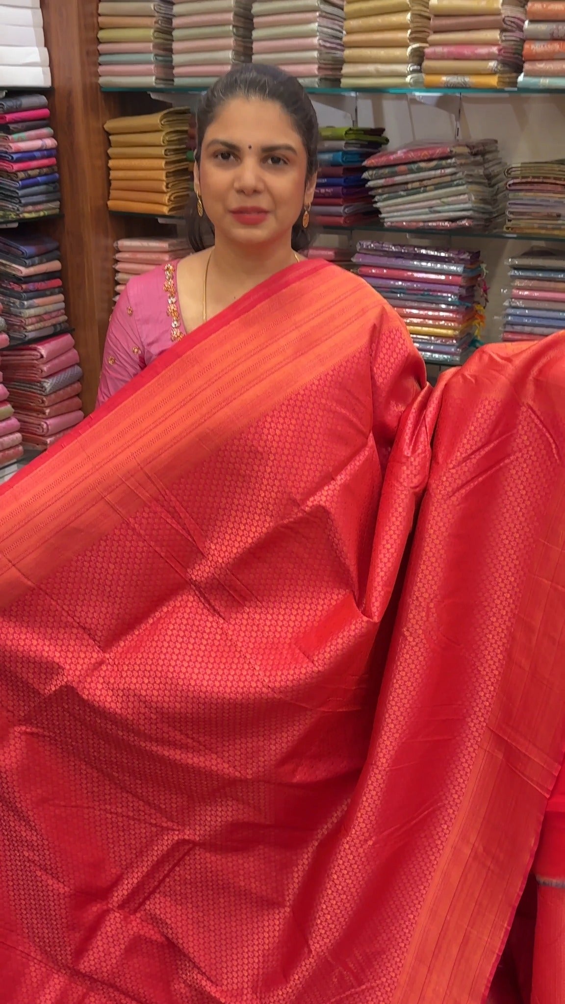 A brocade silk saree features rich, raised patterns woven directly ...