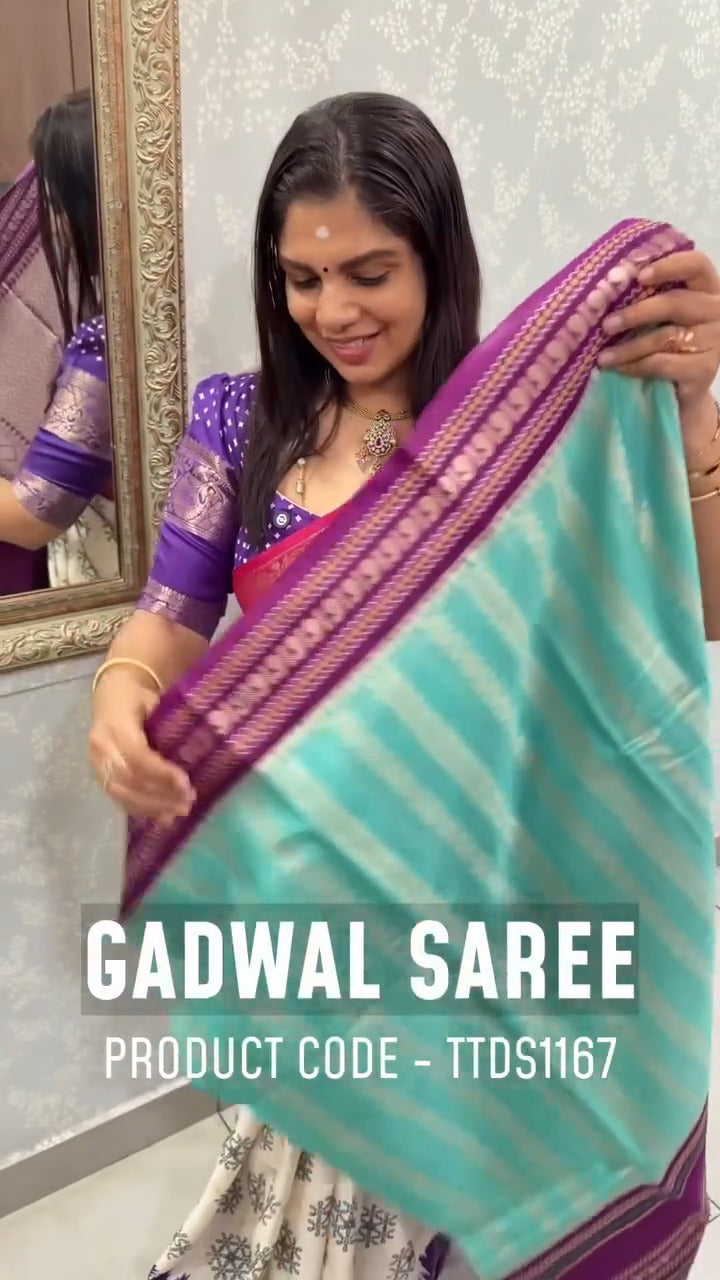 Gadwal saree in a blue shade paired with a striking magenta border,...