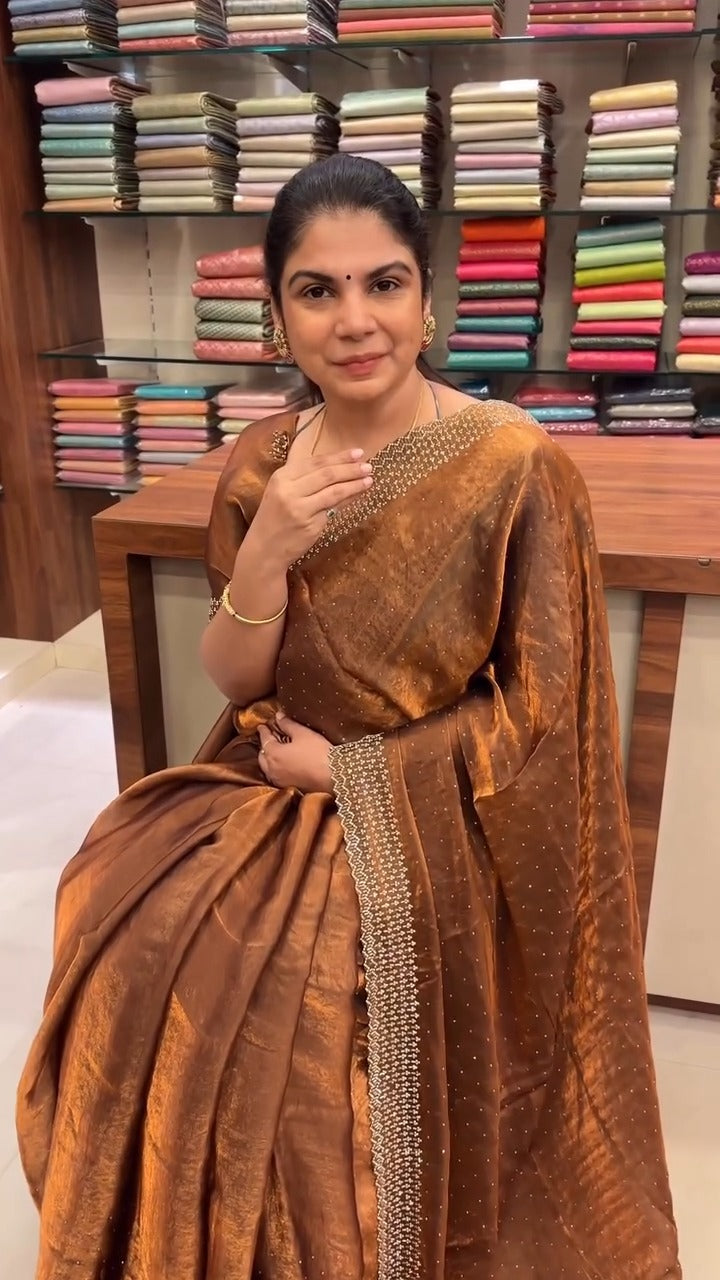 Fendi Designer Saree with Stone Work

A classy bronze-coloured Fend...